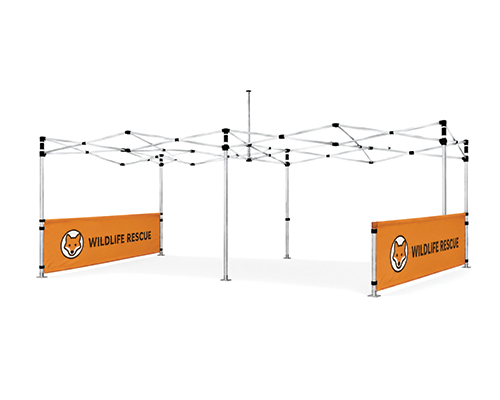 Half-wall canopy tent in a park, offering partial wind and sun protection for a small gathering