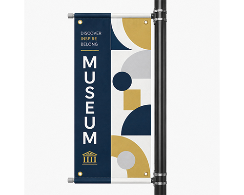 Custom sports pole banner displayed on a street light outside a sports venue